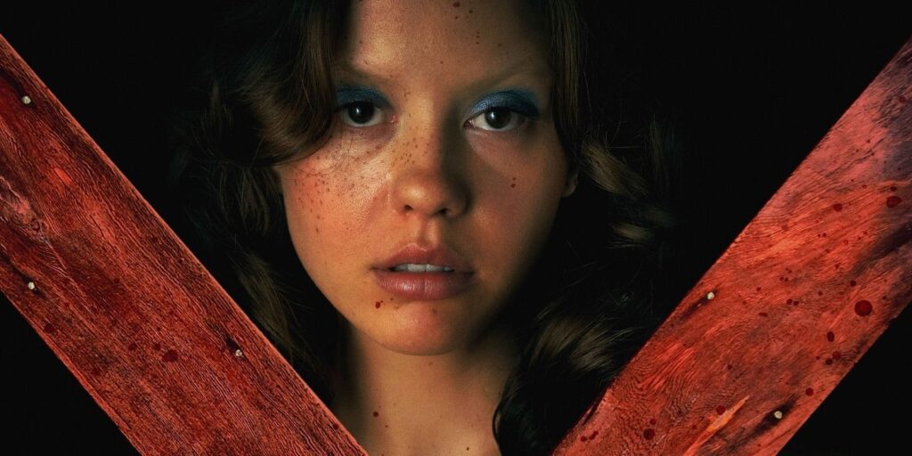 Mia goth's face behind a red X